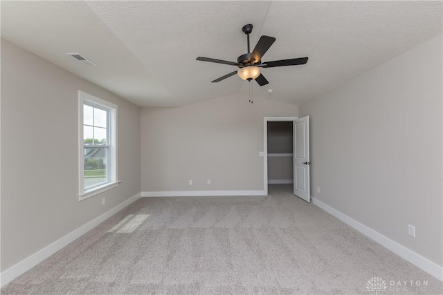 3402 Randall Dr, Cedarville Twp, OH 45314 - empty room with lofted ceiling, a ceiling fan, light colored carpet, and a textured ceiling