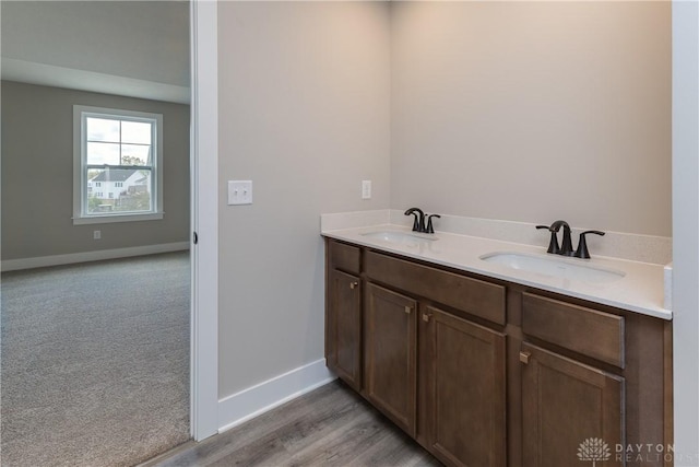 3402 Randall Dr, Cedarville Twp, OH 45314 - bathroom featuring double vanity and wood finished floors