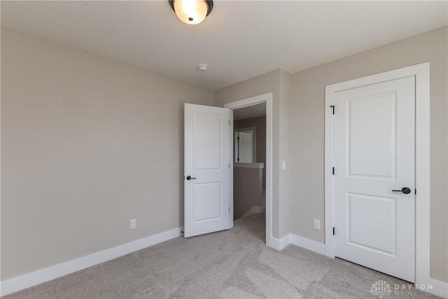 3402 Randall Dr, Cedarville Twp, OH 45314 - unfurnished bedroom with baseboards and light colored carpet