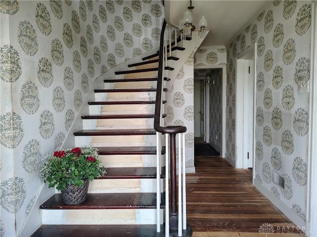 465 W Staunton Rd, Troy, OH 45373 - stairway with wallpapered walls, wood finished floors, and baseboards