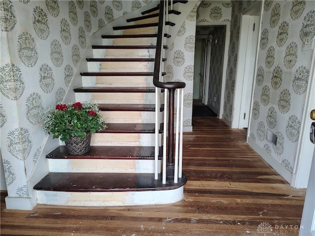 465 W Staunton Rd, Troy, OH 45373 - staircase with wallpapered walls, wood finished floors, and baseboards