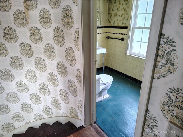 465 W Staunton Rd, Troy, OH 45373 - bathroom featuring toilet, wood finished floors, and tile walls