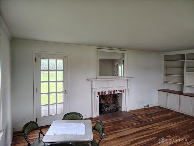 465 W Staunton Rd, Troy, OH 45373 - living room featuring a fireplace, dark wood-type flooring, and ornamental molding