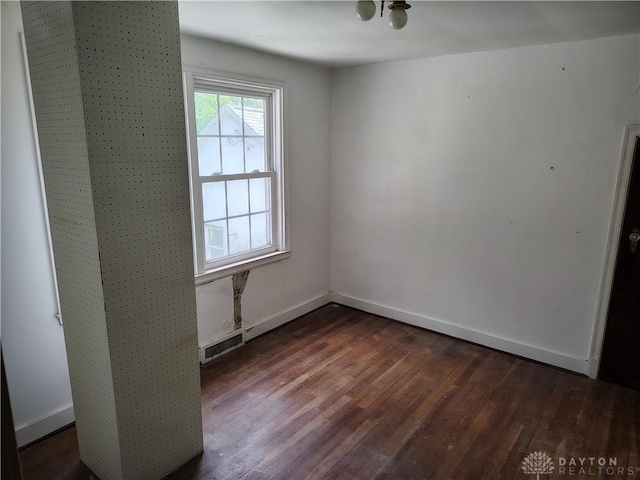 465 W Staunton Rd, Troy, OH 45373 - empty room featuring dark wood finished floors and baseboards