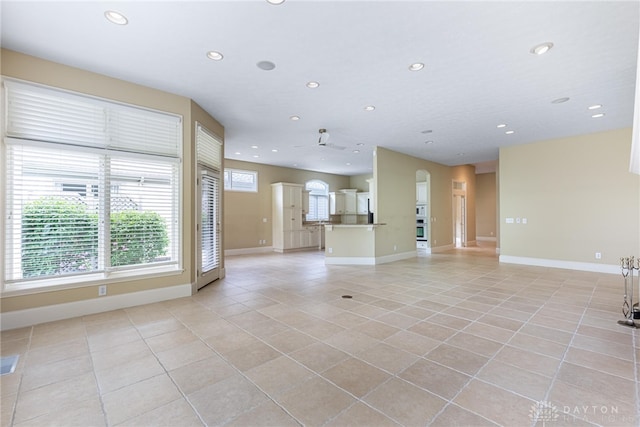 1154 Club View Dr, Centerville, OH 45458 - unfurnished living room with light tile patterned floors, recessed lighting, and baseboards
