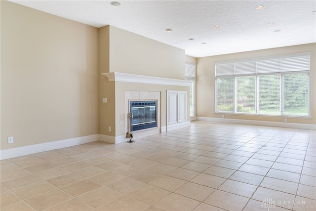 1154 Club View Dr, Centerville, OH 45458 - unfurnished living room with light tile patterned floors, baseboards, a tile fireplace, and recessed lighting