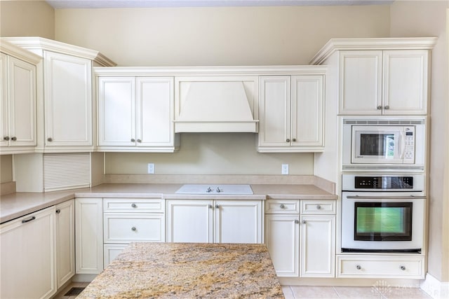 1154 Club View Dr, Centerville, OH 45458 - kitchen with white appliances, custom exhaust hood, and light stone counters