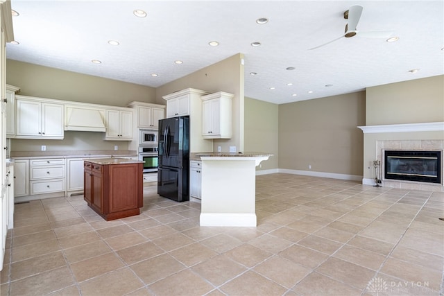 1154 Club View Dr, Centerville, OH 45458 - kitchen featuring appliances with stainless steel finishes, open floor plan, custom range hood, light tile patterned flooring, and a center island
