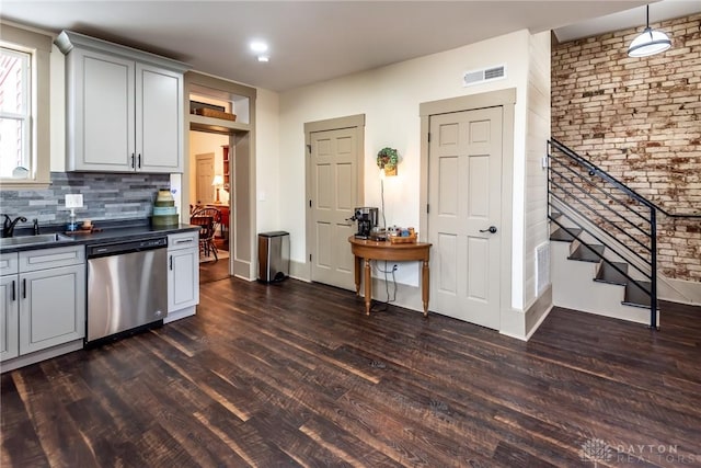 320 N Mechanic St, Lebanon, OH 45036 - kitchen with dishwasher, dark countertops, dark wood-style floors, backsplash, and a sink
