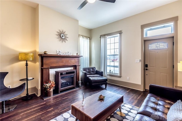 320 N Mechanic St, Lebanon, OH 45036 - living room featuring ceiling fan, wood finished floors, baseboards, and a fireplace with raised hearth