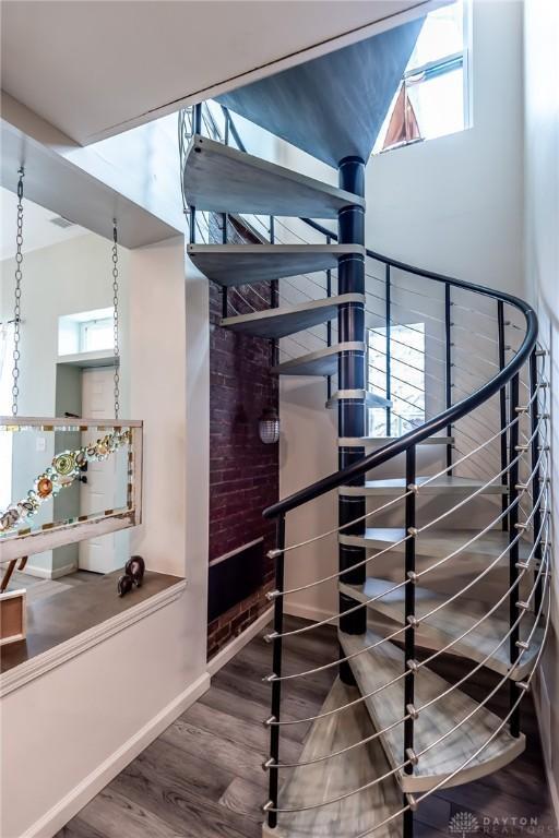 320 N Mechanic St, Lebanon, OH 45036 - staircase with wood finished floors, healthy amount of natural light, and a high ceiling