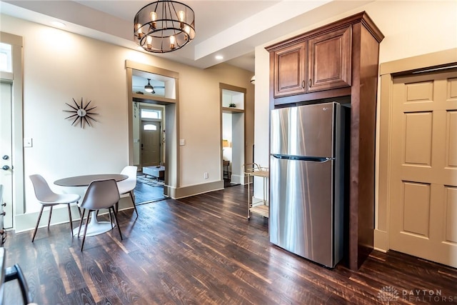 320 N Mechanic St, Lebanon, OH 45036 - kitchen featuring freestanding refrigerator, dark wood-style flooring, a chandelier, brown cabinetry, and baseboards