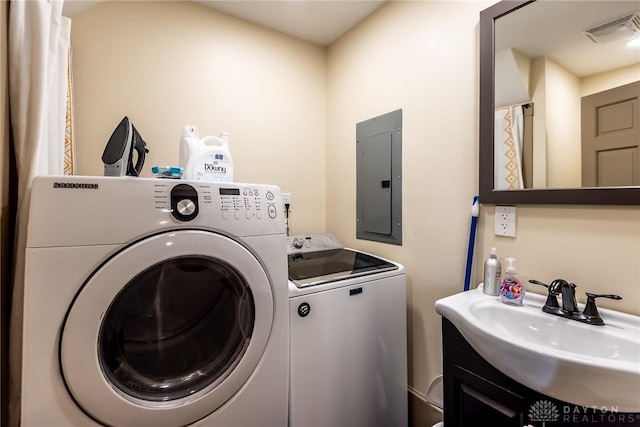 320 N Mechanic St, Lebanon, OH 45036 - clothes washing area featuring electric panel and independent washer and dryer