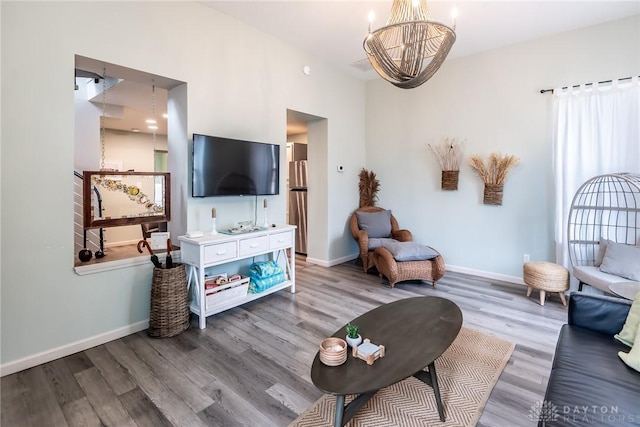 320 N Mechanic St, Lebanon, OH 45036 - living room with wood finished floors, a chandelier, and baseboards