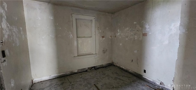 spare room with concrete flooring