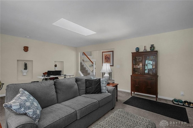 1395 Chickasaw Dr, London, OH 43140 - living room with baseboards, carpet flooring, a skylight, and stairway