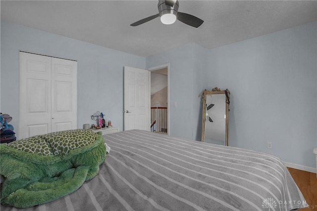 1395 Chickasaw Dr, London, OH 43140 - bedroom with a closet, wood finished floors, ceiling fan, and baseboards
