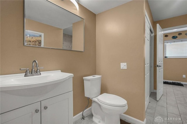 1395 Chickasaw Dr, London, OH 43140 - bathroom with baseboards, toilet, and vanity
