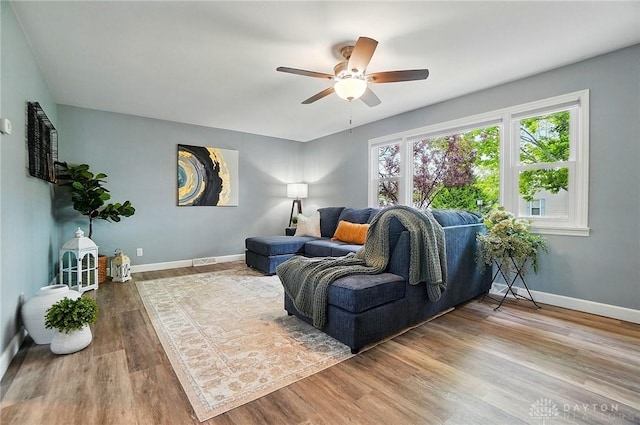 56 W Xenia St, Jamestown Vlg, OH 45335 - living room with ceiling fan, baseboards, and wood finished floors
