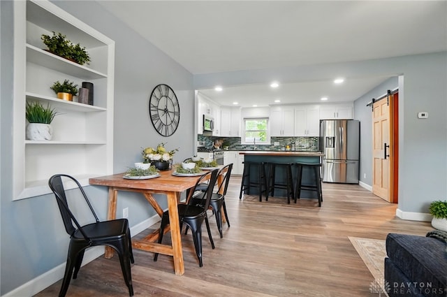 56 W Xenia St, Jamestown Vlg, OH 45335 - dining room with a barn door, baseboards, light wood finished floors, and recessed lighting