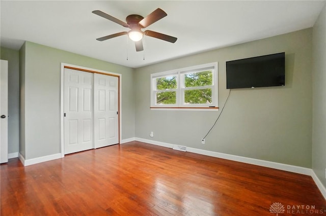 56 W Xenia St, Jamestown Vlg, OH 45335 - unfurnished bedroom featuring a closet, baseboards, and wood finished floors