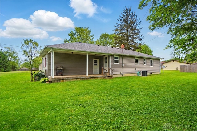 56 W Xenia St, Jamestown Vlg, OH 45335 - rear view of house with a lawn and cooling unit
