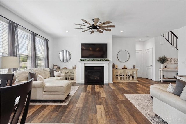 4061 Woodland Ridge Ct, Bellbrook, OH 45440 - living room with ceiling fan, wood finished floors, a glass covered fireplace, recessed lighting, and stairs