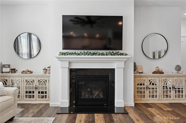 4061 Woodland Ridge Ct, Bellbrook, OH 45440 - detailed view of wood finished floors, a glass covered fireplace, and baseboards
