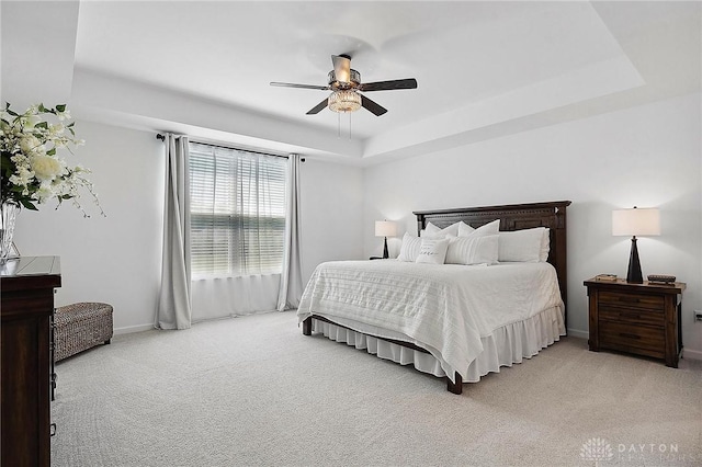 4061 Woodland Ridge Ct, Bellbrook, OH 45440 - bedroom with a raised ceiling, light colored carpet, baseboards, and a ceiling fan