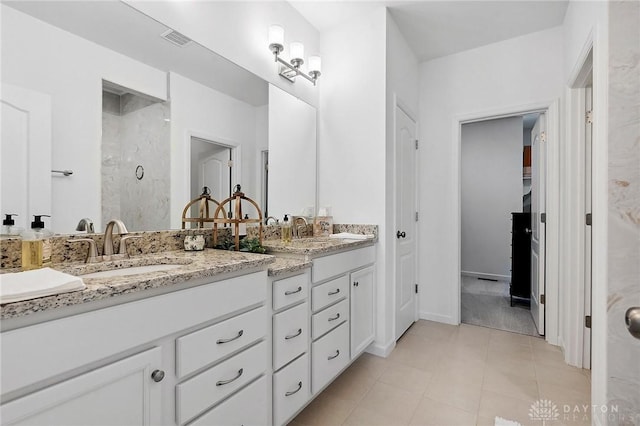 4061 Woodland Ridge Ct, Bellbrook, OH 45440 - full bath with walk in shower, double vanity, tile patterned flooring, and baseboards