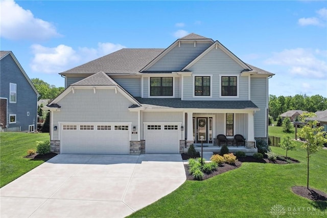 4061 Woodland Ridge Ct, Bellbrook, OH 45440 - craftsman-style home with covered porch, concrete driveway, a front yard, stone siding, and roof with shingles