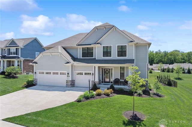 4061 Woodland Ridge Ct, Bellbrook, OH 45440 - view of front facade featuring driveway, covered porch, a front yard, and roof with shingles