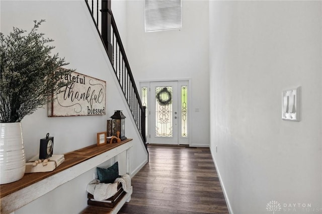 4061 Woodland Ridge Ct, Bellbrook, OH 45440 - entryway featuring stairway, dark wood-style flooring, a high ceiling, and baseboards