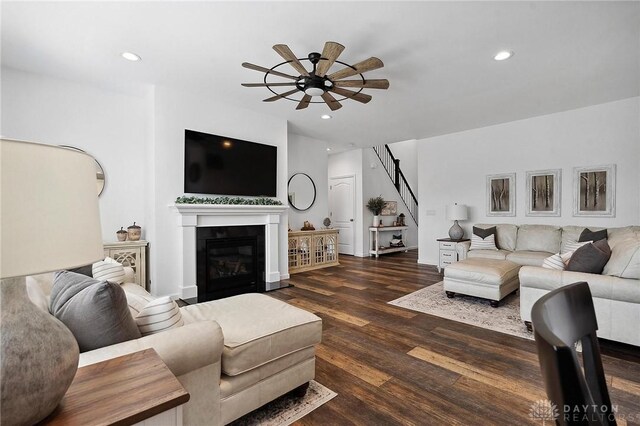 4061 Woodland Ridge Ct, Bellbrook, OH 45440 - living room featuring ceiling fan, wood finished floors, recessed lighting, a glass covered fireplace, and stairs