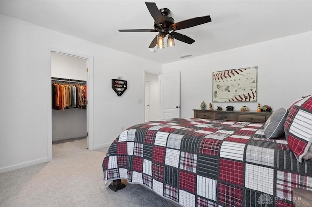 4061 Woodland Ridge Ct, Bellbrook, OH 45440 - carpeted bedroom featuring baseboards, a walk in closet, a closet, and ceiling fan