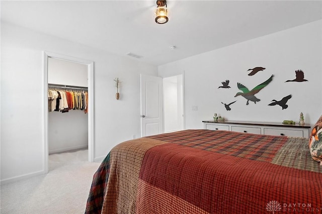 4061 Woodland Ridge Ct, Bellbrook, OH 45440 - carpeted bedroom with baseboards, a walk in closet, and a closet