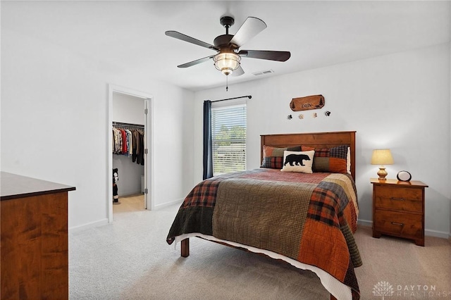 4061 Woodland Ridge Ct, Bellbrook, OH 45440 - bedroom with carpet floors, a spacious closet, baseboards, and ceiling fan