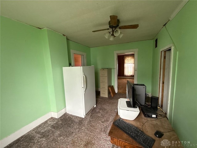 318 E Main St, Bradford, OH 45308 - interior space featuring dark colored carpet, ceiling fan, and baseboards