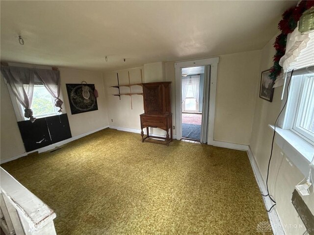 318 E Main St, Bradford, OH 45308 - spare room featuring baseboards