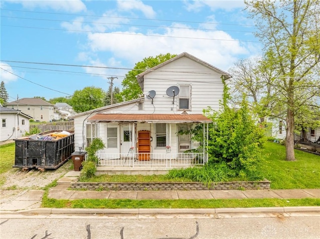 318 E Main St, Bradford, OH 45308 - view of front of home featuring a porch