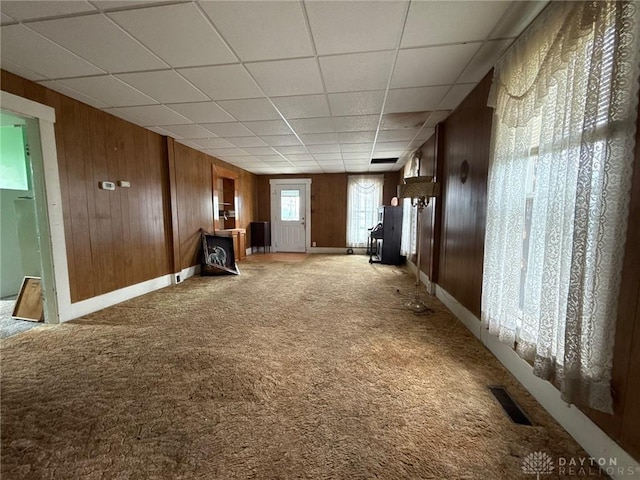 318 E Main St, Bradford, OH 45308 - unfurnished room with wood walls, light carpet, baseboards, and a paneled ceiling