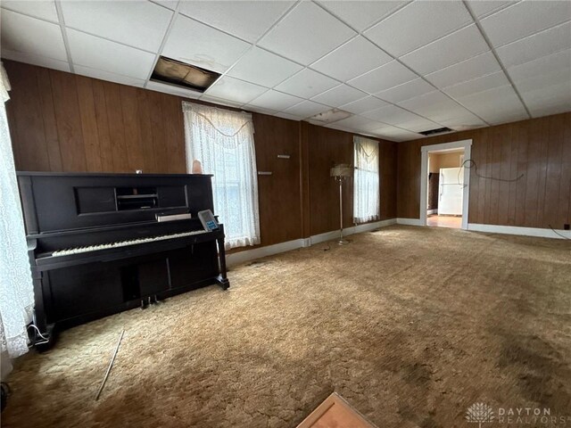 318 E Main St, Bradford, OH 45308 - misc room with wood walls, carpet, a drop ceiling, and baseboards