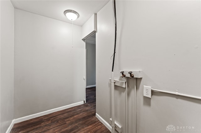 hall with wood finished floors and baseboards
