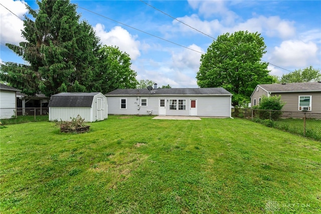rear view of property featuring a patio, a shed, and an outdoor structure
