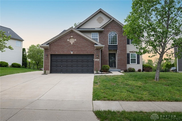 1507 Blake Ct, Fairborn, OH 45324 - traditional home featuring concrete driveway, a garage, and brick siding