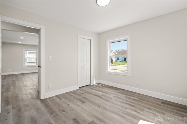 235 N Delmar Ave, Dayton, OH 45403 - unfurnished bedroom featuring baseboards, wood finished floors, and a closet