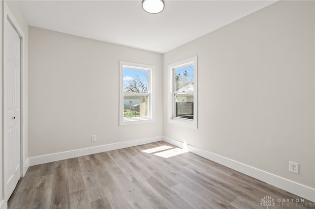 235 N Delmar Ave, Dayton, OH 45403 - unfurnished bedroom featuring wood finished floors, baseboards, and a closet