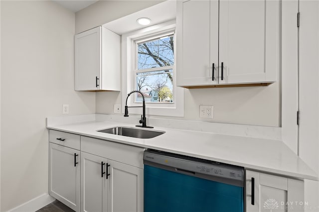235 N Delmar Ave, Dayton, OH 45403 - kitchen with dishwasher, a sink, white cabinets, and light countertops
