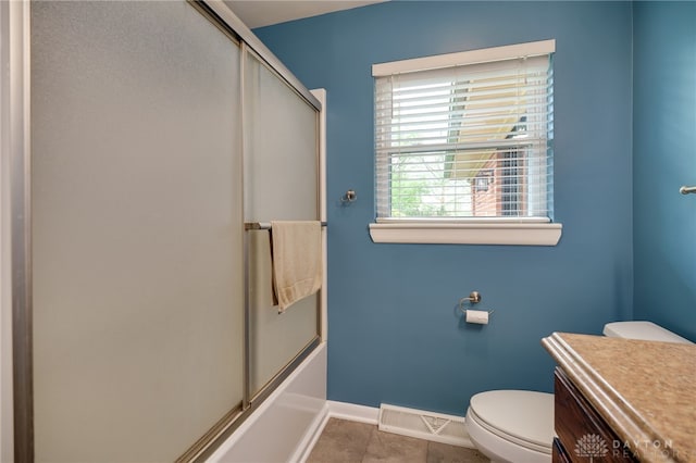 8188 Inwood Ave, Dayton, OH 45415 - bathroom featuring baseboards, toilet, combined bath / shower with glass door, and tile patterned flooring