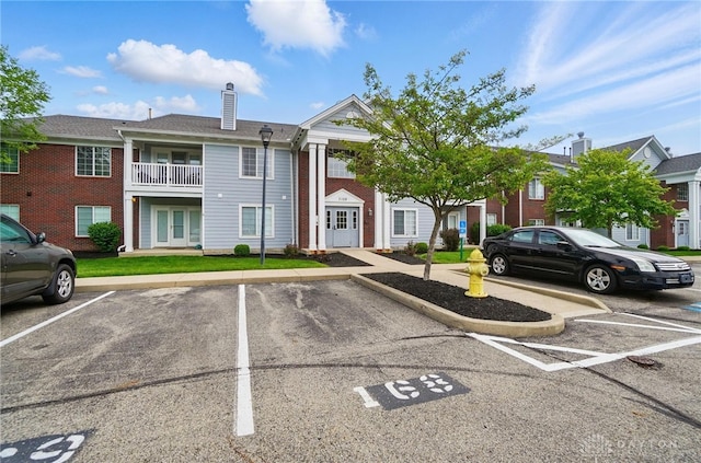 3128 Alexander Pl Unit 206, Beavercreek, OH 45431 - view of property featuring uncovered parking